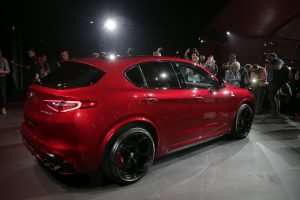 People take pictures of the 2018 Alfa Romeo Stelvio during the Los Angeles Auto Show Wednesday, Nov. 16, 2016, in Los Angeles. (AP Photo/Jae C. Hong)