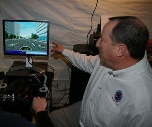 Connecticut Rider Education Program instructor Steve Smith of Naugatuck reviews the performance of a 'rider' who has just finished a test ride on a SMARTrainer. The video screen displays the†a course that the rider†navigated as well shows the rider's speed. Two small video windows served as rearview mirrors to show what's went on behind the rider. Bud Wilkinson / Republican-American