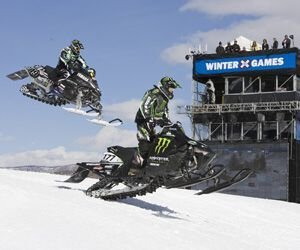 Artic Cat racer Jeff Tweet (177) and Yamaha's Doug Henry (19) battle it out during the Adaptive Snocross final on Buttermilk Mountain in Aspen. Colo. Brian Balsaitis/Shazamm/ESPN Images