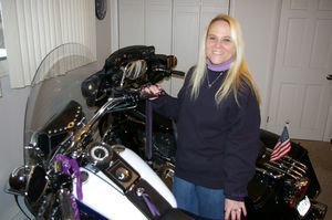 Dina Viel and her 2010 Harley-Davidson Softail Deluxe, which she has stored for the winter in her home office at her Torrington home. Bud Wilkinson / Republican-American 