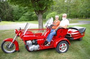 Peg and Ken Acker and the custom trike he built using two four-cylinder motors from Honda CB750 motorcycles. Bud Wilkinson / Republican-American