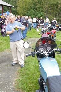 Mike Wallace admires a six-cylinder Honda CBX on display at Rice-O-Rama. Bud Wilkinson Republican-AmericaN