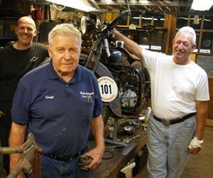 Vintage Indian expert George Yarocki of Torrington, center, in his workshop with Motorcycle Cannonball participant Jeff Alperin, right, and crew member Tim Raindle. Bud Wilkinson / Republican-American 