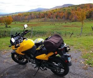 The bright yellow color of a 2008 Suzuki V-Strom fits in nicely with the fall foliage found in the Catskills on Columbus Day. Bud Wilkinson / Republican-American