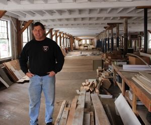 Ken Kaplan, president of the New England Motorcycle Museum, shows off one of the floors inside what was once Hockanum Mill in Rockville that is being transformed into a 40,000-square-foot museum. Bud Wilkinson / Republican-American