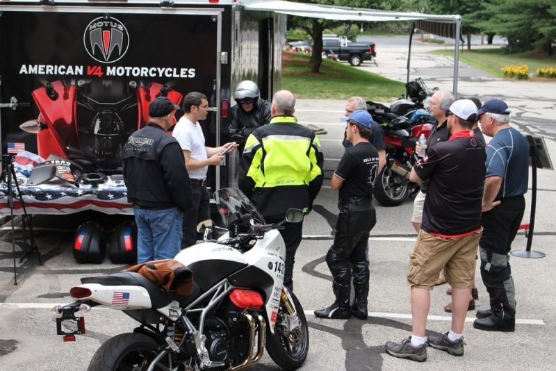 Motus Motorcycles president and co-founder Lee Conn (in white t-shirt) brief riders on the sport-touring motorcycles his company builds in Birmingham, Ala. Bud Wilkinson / Republican-American 
