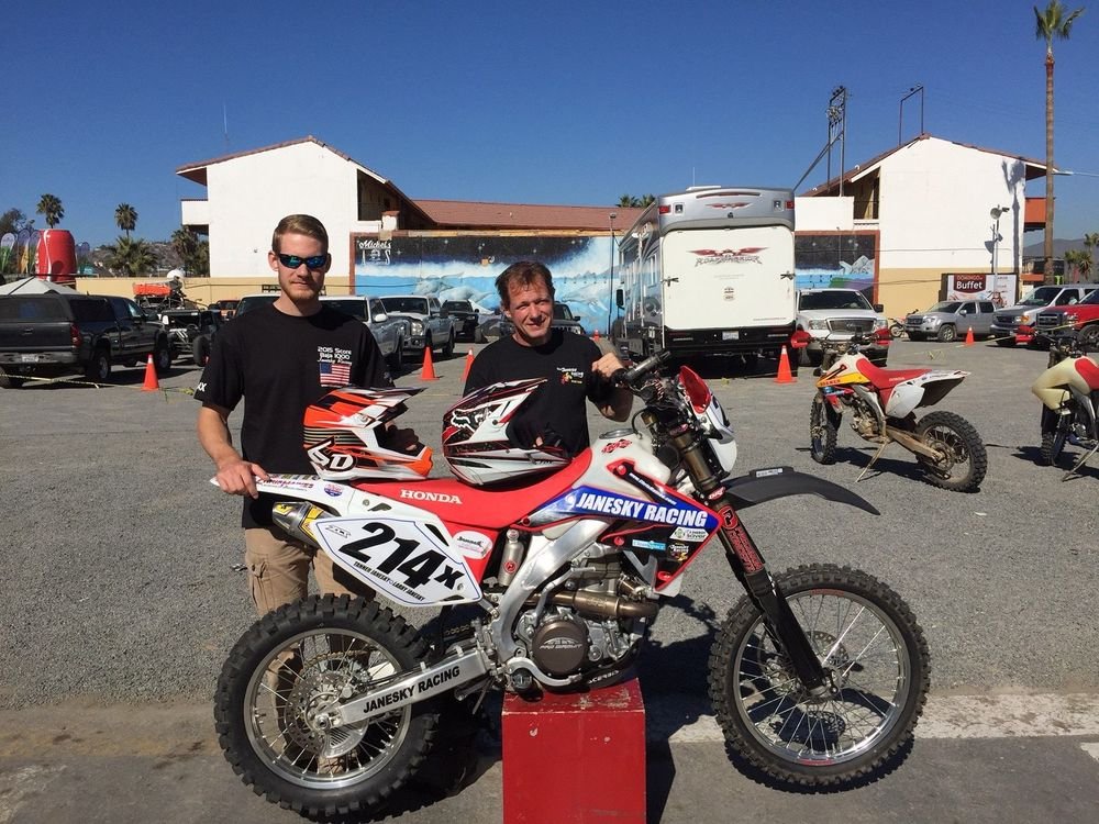 Tanner Janesky, left, and Larry Janesky with the 2009 Honda CRF450X that they rode in the Baja 1000. Credit: contributed 