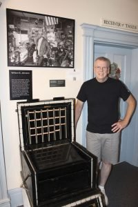 Tim Carney of Danbury and the combination cash box and safe that was used in William B. Johnson's Harley-Davidson dealership in Somers, N.Y. (Bud Wilkinson Republican-American)