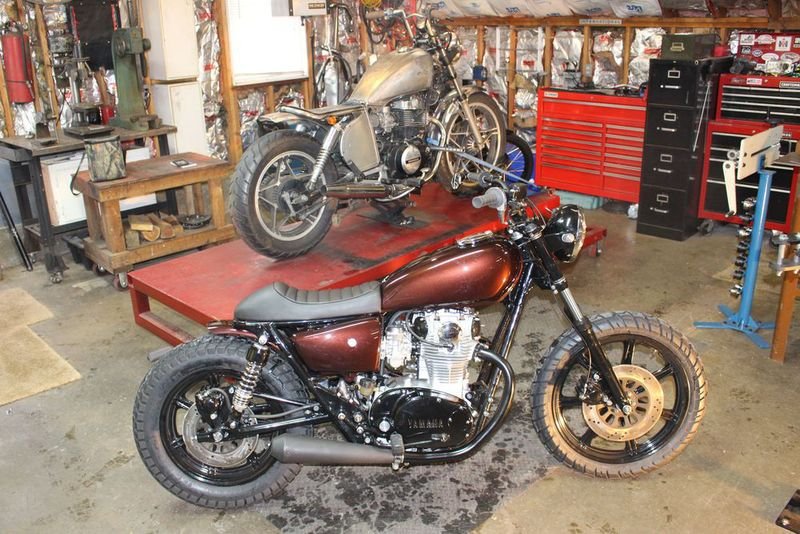 The 1980 Yamaha XS650 that Eric Pleil has completed, foreground, and the 1985 Honda CB450 that he's working on for a customer. Bud Wilkinson Republican-American 