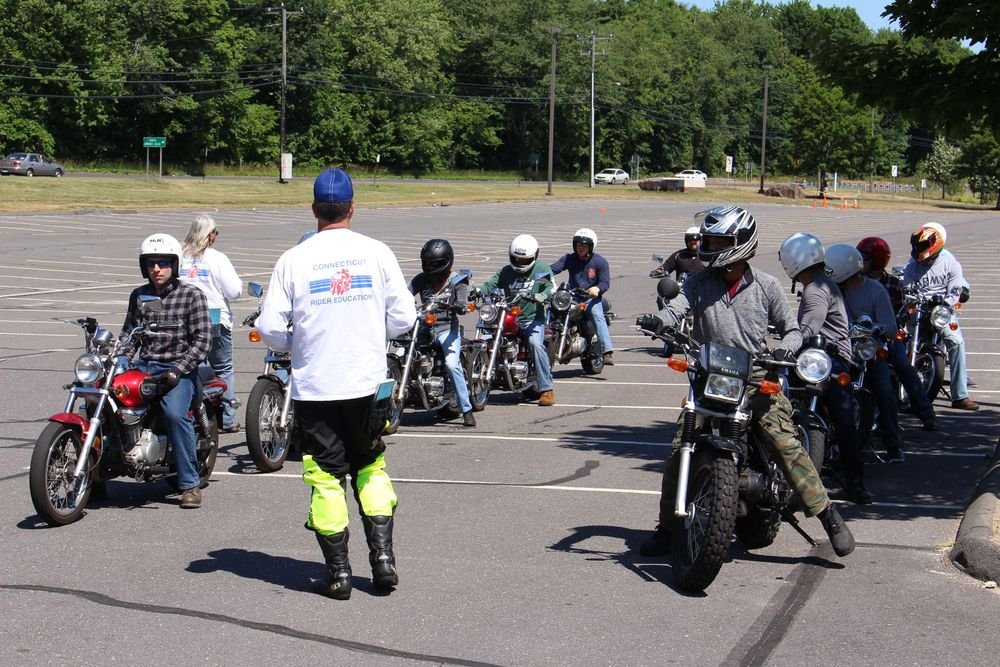 Helmeted students taking the Basic Rider Course offered by the Connecticut Rider Education Program last summer in Farmington. The course urges riders to wear full-face helmets and other protective gear. Bud Wilkinson Republican-American 